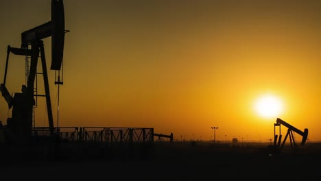 oil pumps time lapse at sunset -