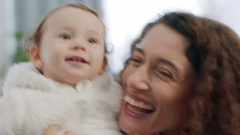 family, mother and baby being funny at home