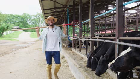 farmer with tools and cows