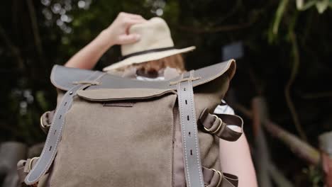 handheld view of tourist with backpack traveling