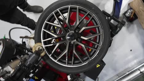 top-down view 360 of a tire spinning in a machine to fix tires