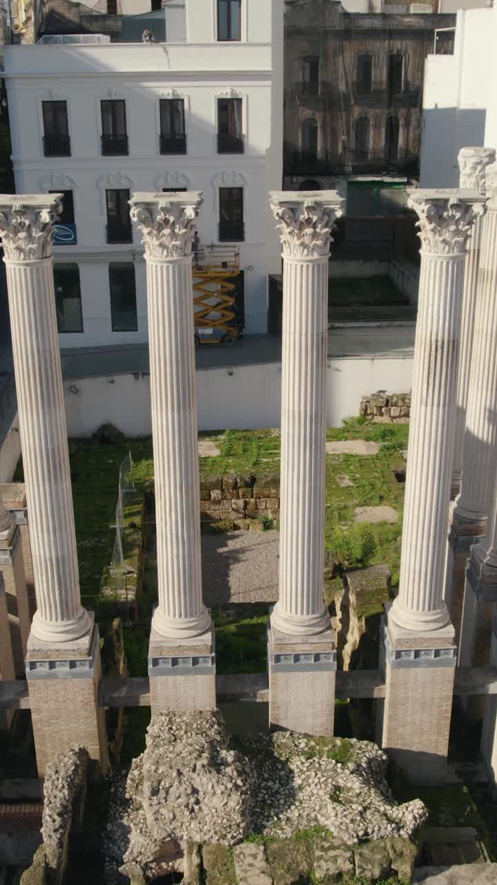 Ancient Roman temple in Córdoba, highlighting the archaeological site and surrounding cityscape. Vertical aerial