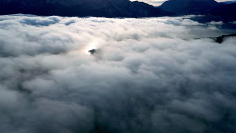 sky is filled with clouds and the sun is shining through them