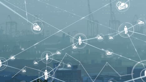 animation of network of digital icons against aerial view of cityscape
