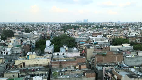 4K-Aerial-Shots-of-New-Delhi-Residential-Suburbs-on-a-beautiful-day-gliding-over-Rooftops,-streets,-parks-and-markets-in-India