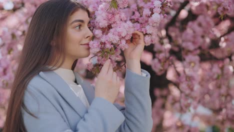 woman enjoying cherry blossoms in spring