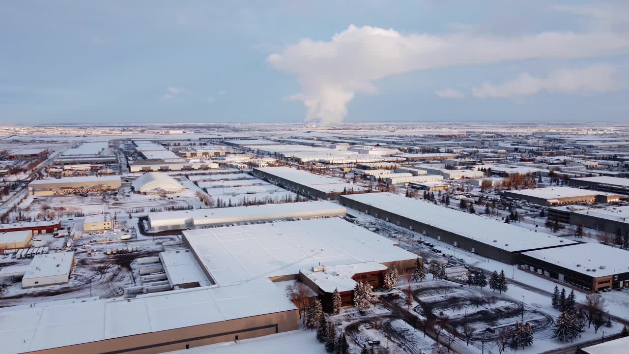 Drone view of a power plant's winter steam cloud in Calgary