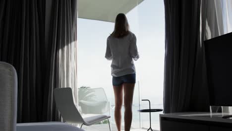 Caucasian-woman-walking-in-hotel-room