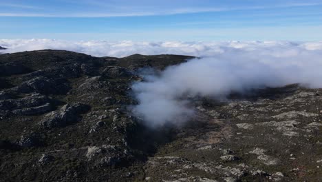 aerial view of a magical valley filled with clouds