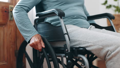 man, hands and home for moving wheelchair