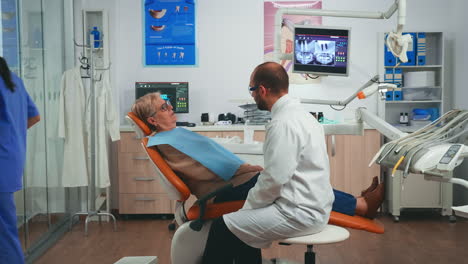 orthodontist discusses an mri scan with patient