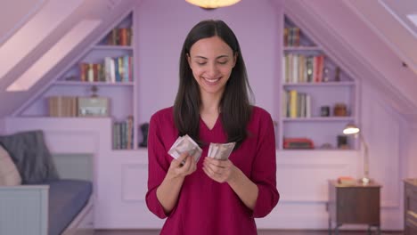 Happy-Indian-woman-counting-money