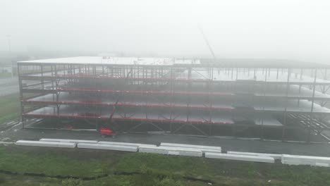 building under construction foggy day