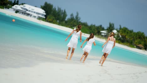 female caucasian children having fun on tropical beach