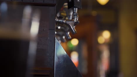 out of focus beer pouring at a pub