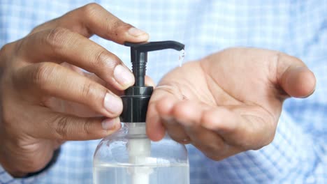 applying hand sanitizer