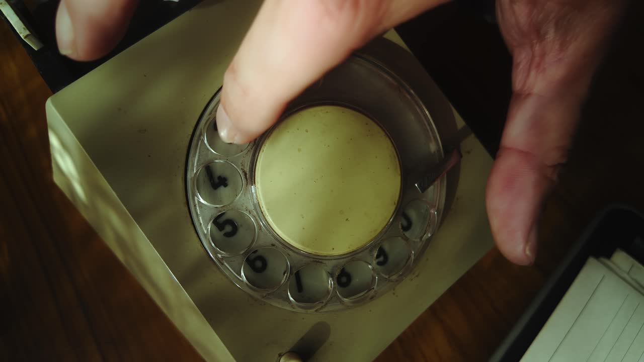 Callers Finger dialling number on rotary telephone landline CLOSE-UP