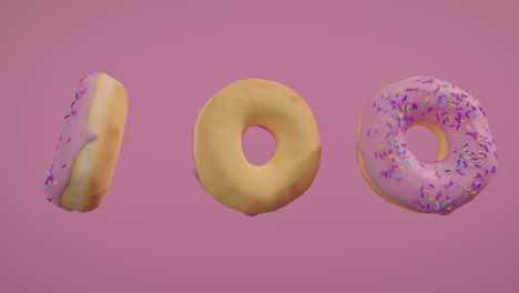pink glaze donuts on a pink background