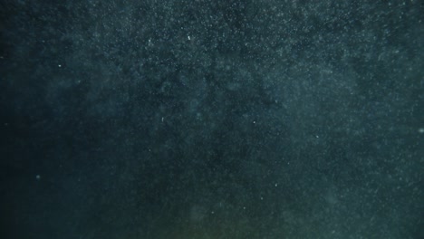 abstract underwater background. dirty water close up.