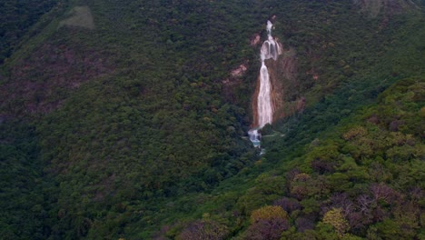 aerial pull back wide shot of the velo de novia waterfall in the chiflon park, chiapas