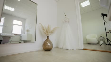 Wedding-Dress-hanging-on-a-wall