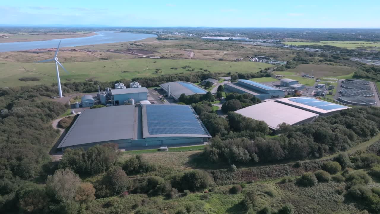 Low Buildings Of The Water Treatment Plant With Solar And Wind Power Next To River Wyre, Fleetwood, Lancashire, UK