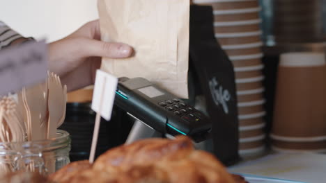 close up customer making contactless payment using smart watch mobile money transfer buying coffee in cafe enjoying service at restaurant