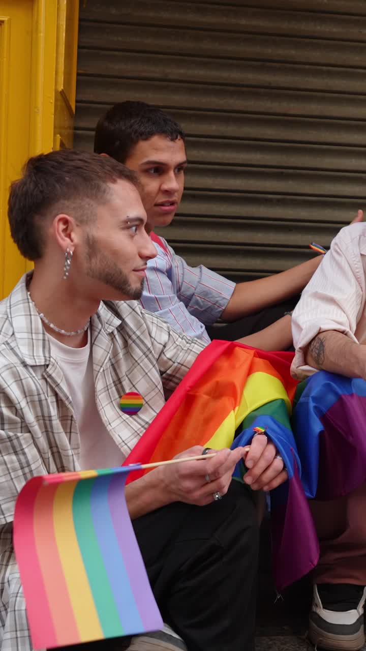 Young Men Celebrating Pride with Rainbow Flags