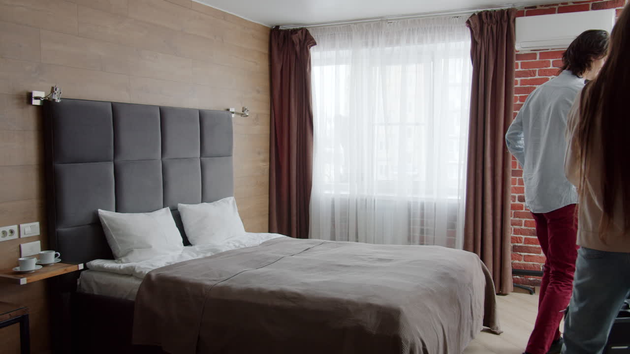 Happy Couple in a Hotel Room