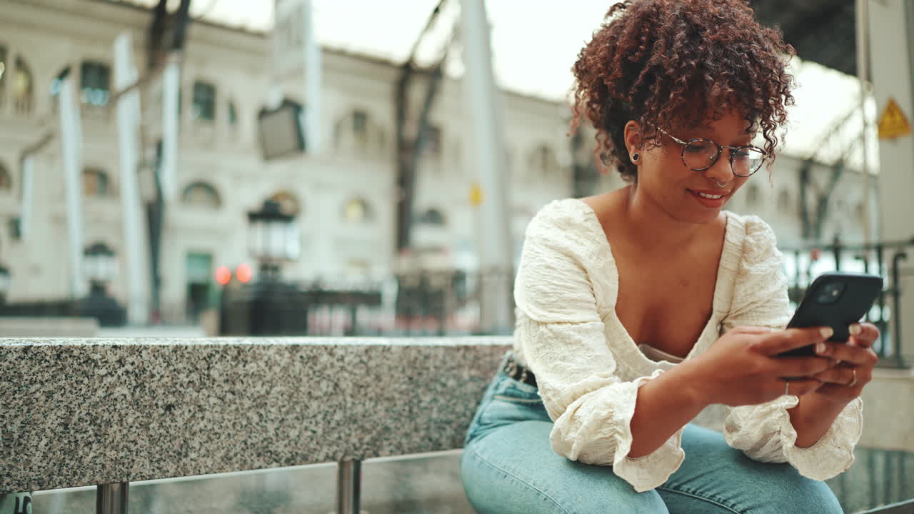 Woman using phone in urban setting