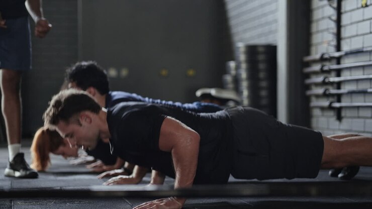 Group Fitness Class Performing Push-Ups