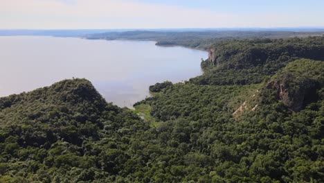 drone shot of stunning parana river and green highrise mountains, argentina