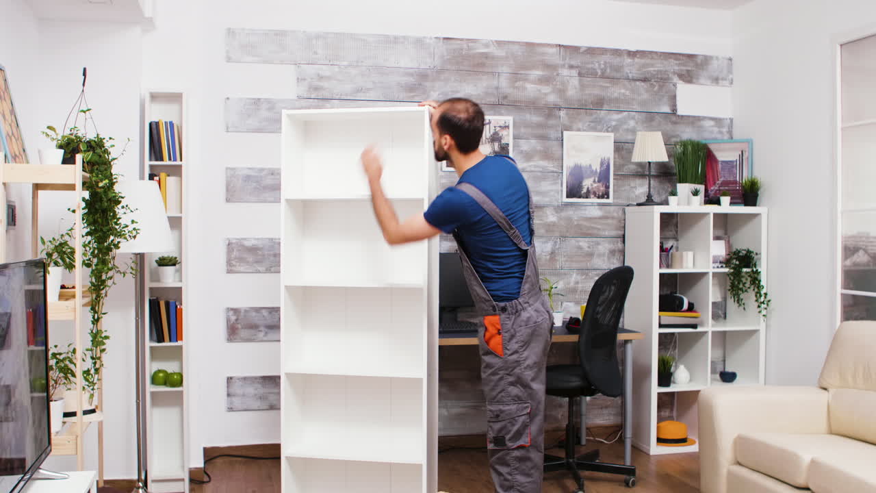 Man assembling a bookshelf in a living room