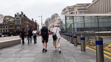 people walking on a busy london street