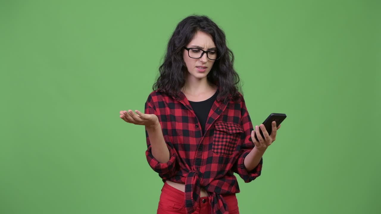 Young beautiful businesswoman using phone