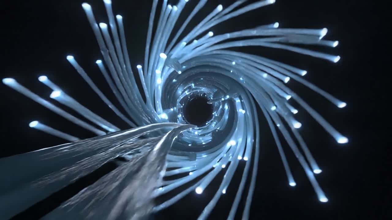 Telecamera che si muove in avanti attraverso un tunnel a spirale luminoso, con nastri che si stringono verso un vuoto centrale.