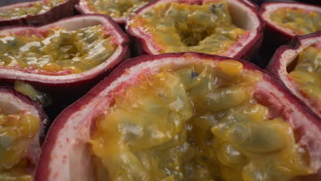 mesmerizing close up rotating passion fruits, juicy tropical maracuya, exotic fruits, 4k macro shot