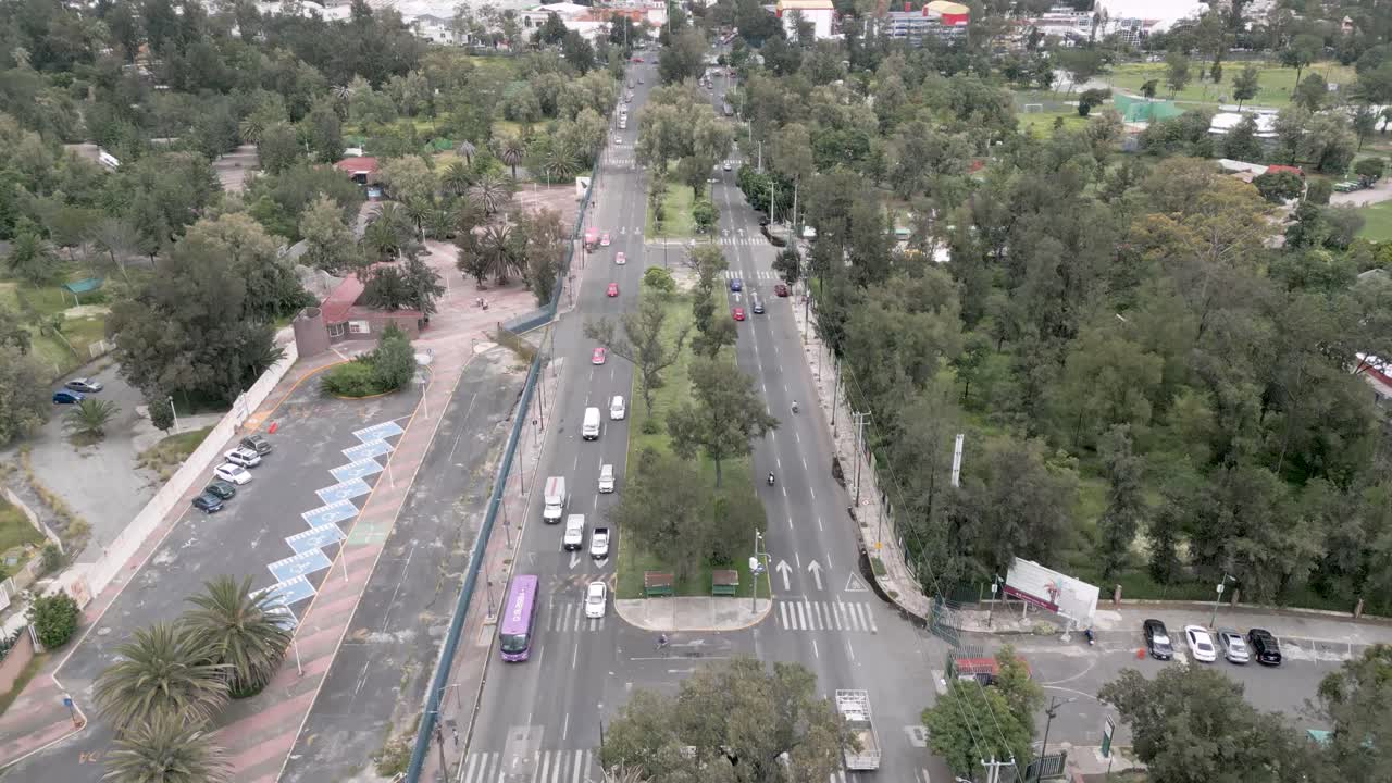 Forward Drone Aerial Shot Over City Traffic With Trees and Houses in Urban Mexico – Cloudy Day 4K