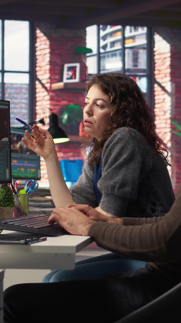 Vertical Video Creative couple working together on video editing software for movie making
