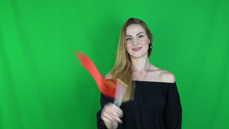 blonde woman waving in front of china flag green screen, chroma key background