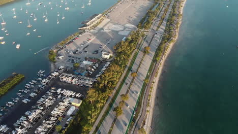 stunning aerial bird's view of miami marine stadium with road by sea, forward