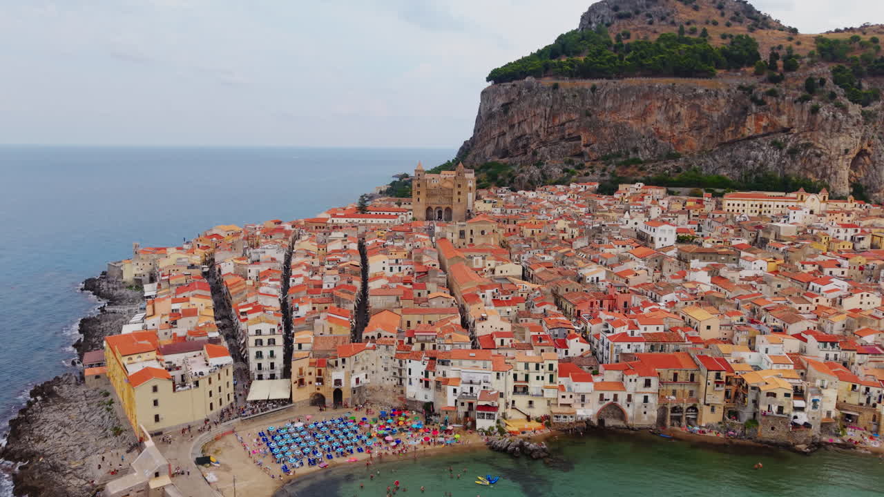 Aerial view of Cefalù, Sicily, historic town by the sea with colorful houses