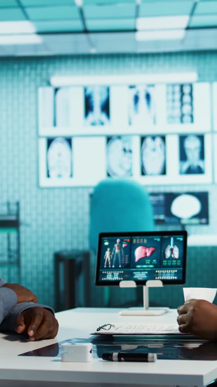 Doctor Explaining Human Anatomy to Patient on Digital Tablet