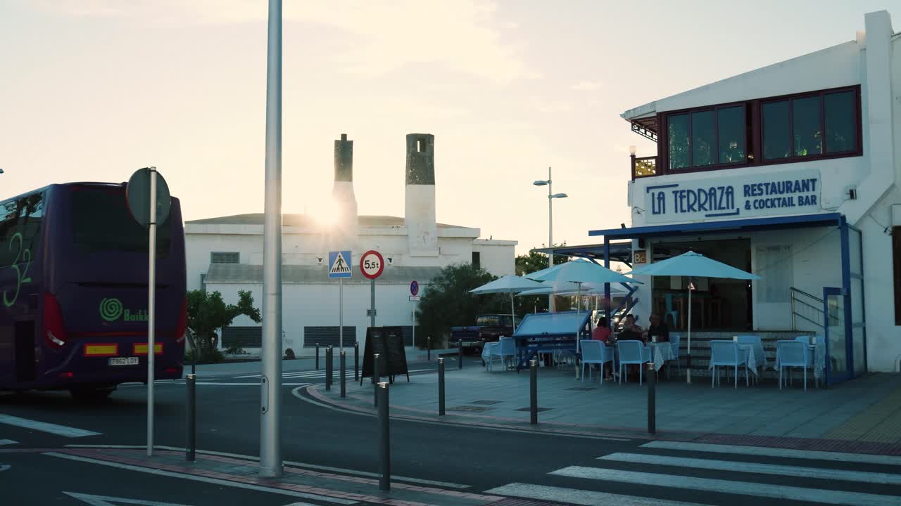 Sunset City Street Scene with Restaurant and People