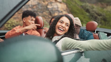friends enjoying a road trip in a convertible
