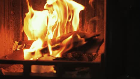 reflection of fire in stove glass pan to fire