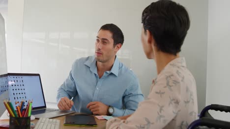 Young-man-and-woman-working-in-a-creative-office