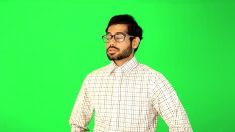 indian-business-guy-standing-with-green-background