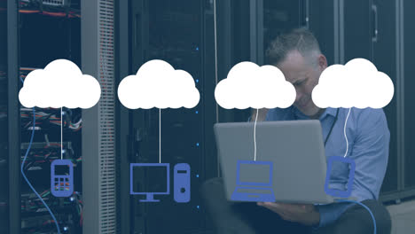 Animation of digital clouds with electronic devices over caucasian it technician with laptop