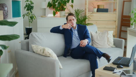 confident businessman on couch